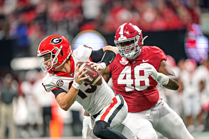 Georgia QB Stetson Bennett evades a defender in the CFP title game.